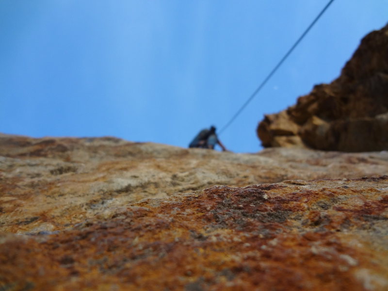 Climbing Pink Canoe (5.10a)in Rock Canyon Utah