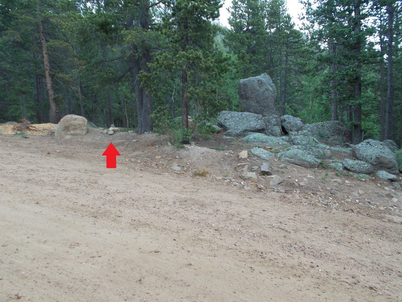 Red arrow marks cairn, after leaving parking area, just past rest room and access road, direct trail to the West Face.