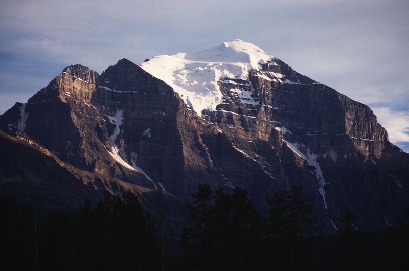 Mount Temple as seen from the Lake Louise townsite. The Greenwood-Jones climbs the buttress that separates sun from shadow in the middle-left of the photo.