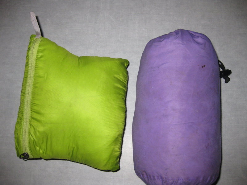 Nano jacket (no hood) on left and Atom LT w/ Hood on right. Both sacks have room for cell phone, bars etc with the purple sack having more space than nano pocket. 