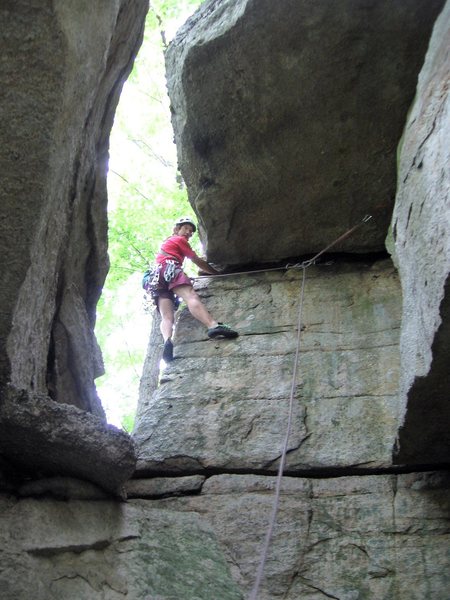 Leaving the cave at the start of the route.  Be careful that the rope doesn't upset the next cam as it makes the turn upwards at the outside corner.