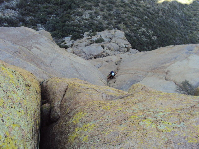 The "Organ Grinder" - looking down on the 5.10 fist to OW crack that splits the roof on the crux pitch (traditionally the 2nd pitch, the 3rd pitch as we climbed it). There is an excellent belay station immediately above the crack.