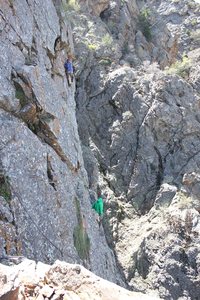 Durf demonstrating another fine example of a good belay while the climber is free climbing into the unknown.  The roof of the second pitch of The Fools Progress is right above the top climber.