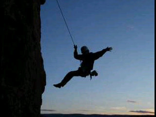 Rappelling down "Dry Creek" during sun set