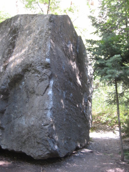 Northwest Corner.  Slap left hand up the arete for the first few moves before moving to crimps on face.  Easy top-out!