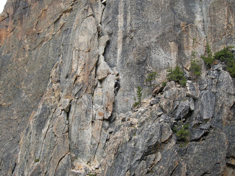 Climber on p.2 of the Beckey Route. Photo from Concord Tower.