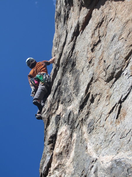 Will Spaller climbing through the mental crux of journey home.  Moments later a massive raven hovered behind him, an omen for the good day ahead of us.