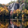 Stonehouse Pond in October. On the far left you can see the top of the routes Moe Howard Died for Our Sins and Geezer Pleaser. The sun/shade line ridge is The Nose. Slab with the pine tree growing out of it is Down by Law. The face to the far right is the Luna Wall.