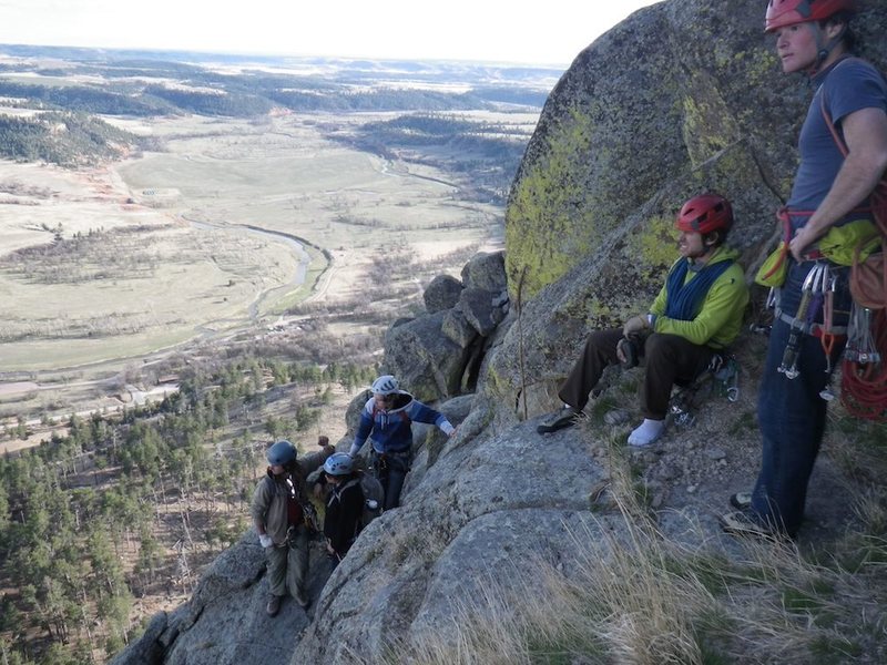 Here's a photo of Gil I took this year on top of Devil's Tower.  Gil is the one in the green sitting.  We're waiting to rap off.