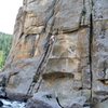 Tony B. Leads up into the crux of Water World (11-), at Castle Rock.