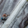A climber laybacking Apron Strings.