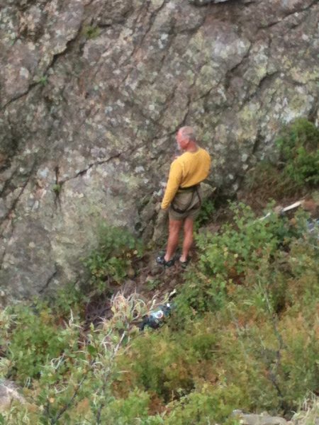 Mr. Hanson looking around hoping the rain ends.