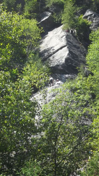 Belay point (spacious with 3 tired looking bolts) and the upper pitch.