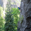 Jon Scoville, tackling the roof/arete to the left of the finishing slabby part.