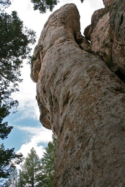 The right-most line of bolts up the arete then winding around the back to ascend the gray streaked rock.