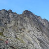 The western flank of the Main Wall. The Gash begins above and to the left of the climber. 