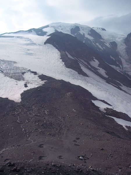 Sunrise Camp at the bottom, the route runs straight up the glacier and rounds the bend at the top.