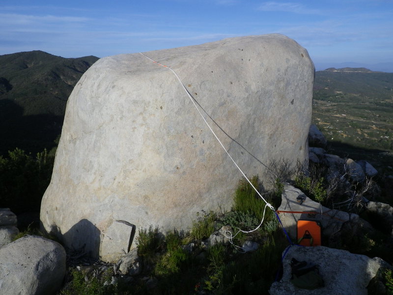 view of the anchor and static rope over the top, climb is on the other side