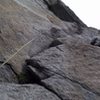 On the ledge after the opening crux of pitch 4.