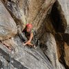 Brenda rests on a good foot hold near the end of the undercling section.