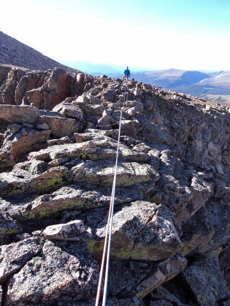 Joe is on the other side of the sidewalk traverse to walking terrain.