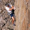 Moving off the arete just below the upper endurance crux dyno. (Dan Hare photo)