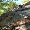 Joshua on the bulging slab over the flake.