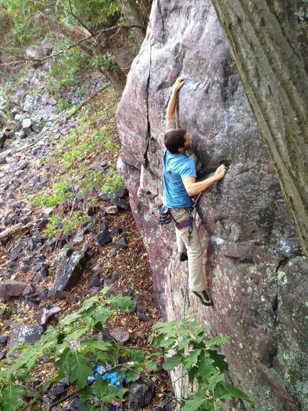 Ryan pulling through 1 of 3 crux moves on Two Dead Ducks. 