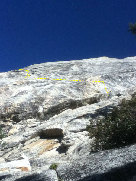 Start on the right side of a big flake, traverse left to obvious orange flake with a bolt a few feet above, then traverse on big holds left. Then back right to the top when easier. One crack for a P1 belay.