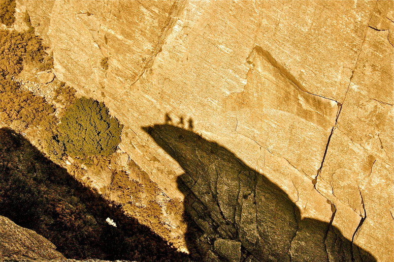 On the summit casting shadows.