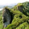 The Ray of Light Spire, back side of Adam's Apple, Sokehs Ridge and Pohnpei Island, as seen from the top of Sokehs Rock. 