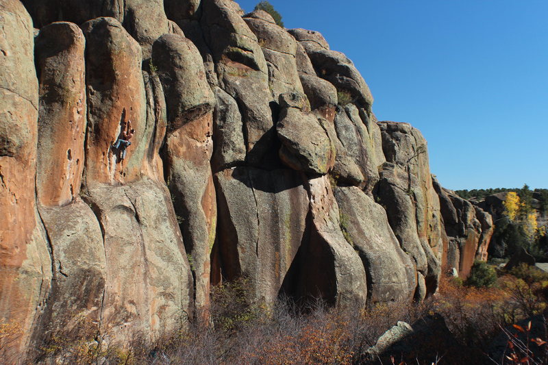 Ian becoming the rocket man. <br>
<br>
Clipping the first bolt off the ledge. Easy climbing on jugs, but dicey if a fall is taken before protection is placed. 