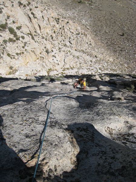 Looking down pitch 6. The climber is just above the second roof.