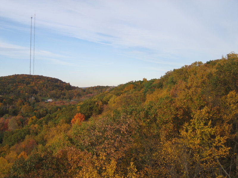 The view north. Two people on top of Pinnacle dead-center, Rattlesnake Mountain on left with towers.