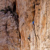 Jessie Rushbrooke at the top of the first pitch of The Mighty Logan 5.11a, photo Emma Alsford