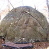 Battle of the Bulge climbs the left arete in the photo. The chalked, left most dark crack is used (right hand after the start), and then around the arete for the left hand on slopers.