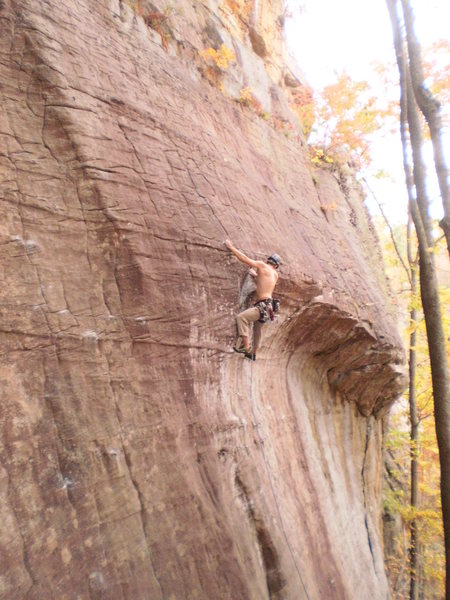 Pulling through the crux roof on Yell Fire!