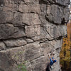 Fred Wiggins starts into Vicious, 5.10b, Satellite Wall.