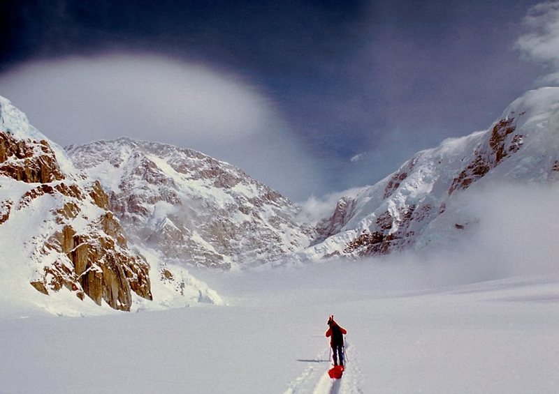 The Rib is sunlit and rises left to right from the upper East Fork Kahiltna Glacier to the crest of the South Buttress. The Radio Tower is visible behind the Rib. Chuck Crago photo. 