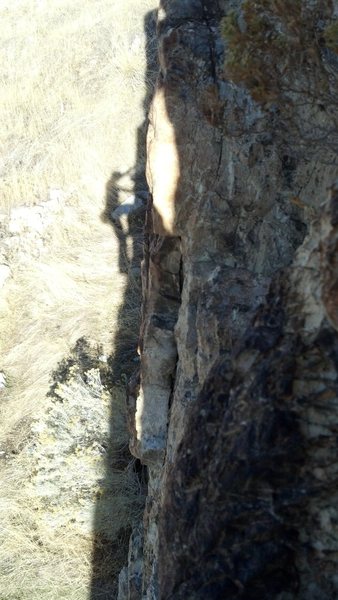 A shadow portrait from near the top of this highball boulder problem