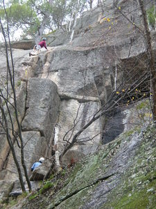Unknown climbers on Funhouse.  The leader is just past the bulge moves on the first pitch.
