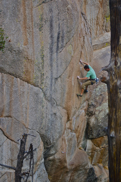 Climber on the first technical, crimpy crux, most likely crimping more than required. Photo: John Hinrichsen.<br>
