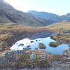 In the background Scafell Pike, 3210', the highest mountain in England. Photo Armstrong