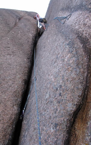 Belaying just above the crux section on pitch 2