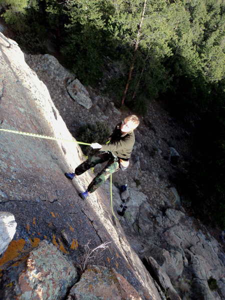 Chris rappels off.