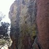 Bolted Arete on north side of boulder.