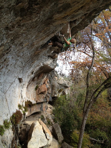 Rachel high on the route, tugging on jugs.