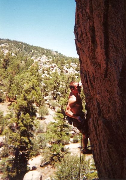 Chuck on the headwall of Pistol Whipped (5.11a), Holcomb Valley Pinnacles