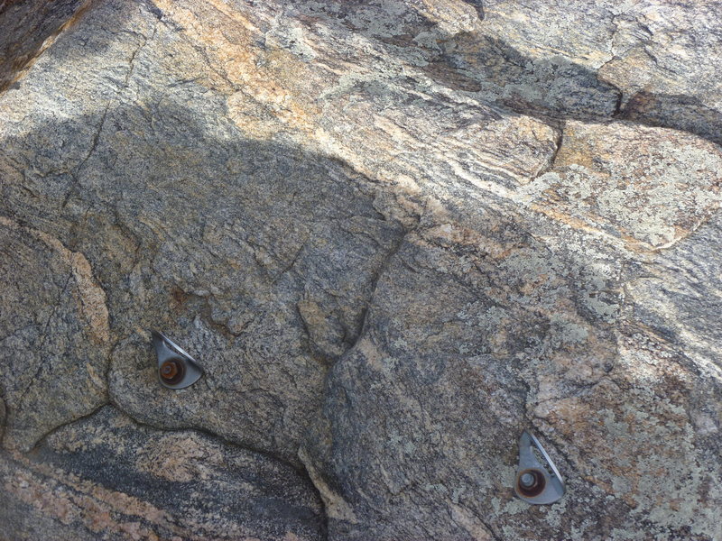 Bolts above the arete.  You need long runners.