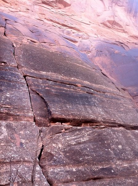 Stepping Stone goes up the obvious crack. The anchors are a bit tough to spot. Angel of Harlem goes up the flake system in the corner to the right.